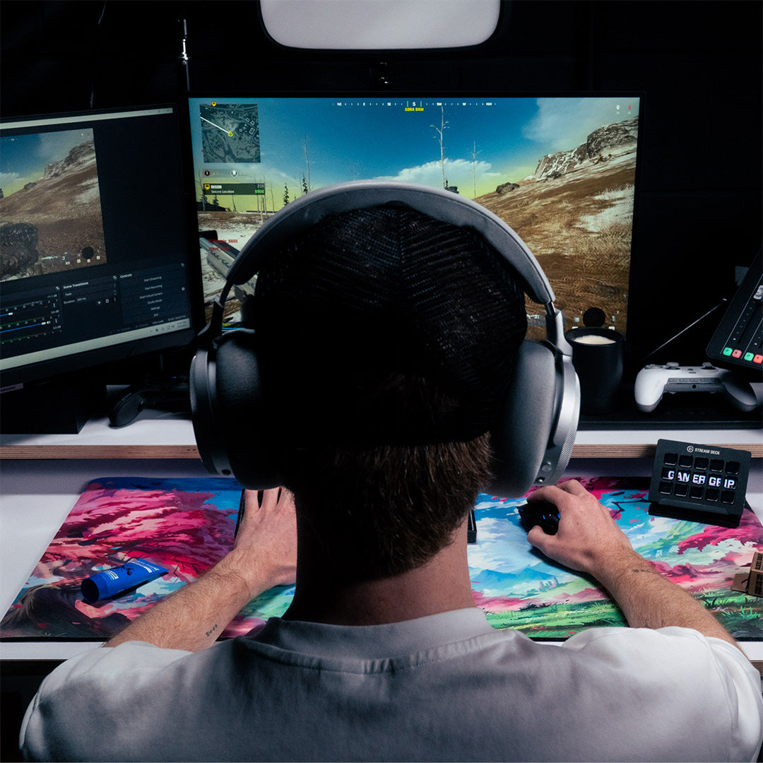 Gaming setup with controller in hand